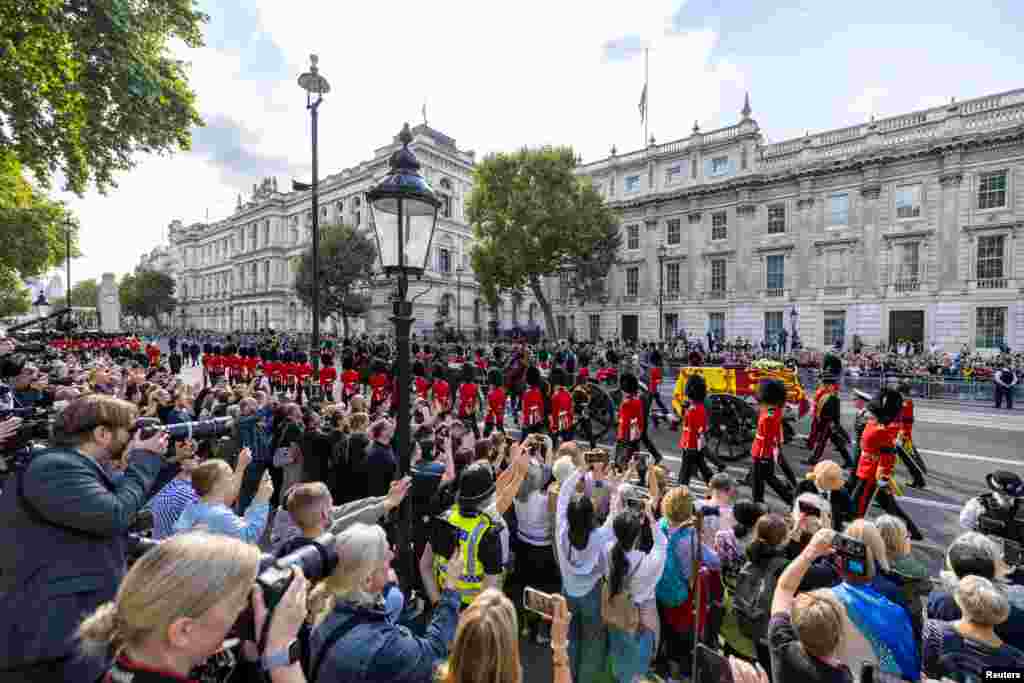 Tens of thousands lined London's streets to catch a glimpse of the coffin of Britain's Queen Elizabeth II in London, Sept. 14, 2022.