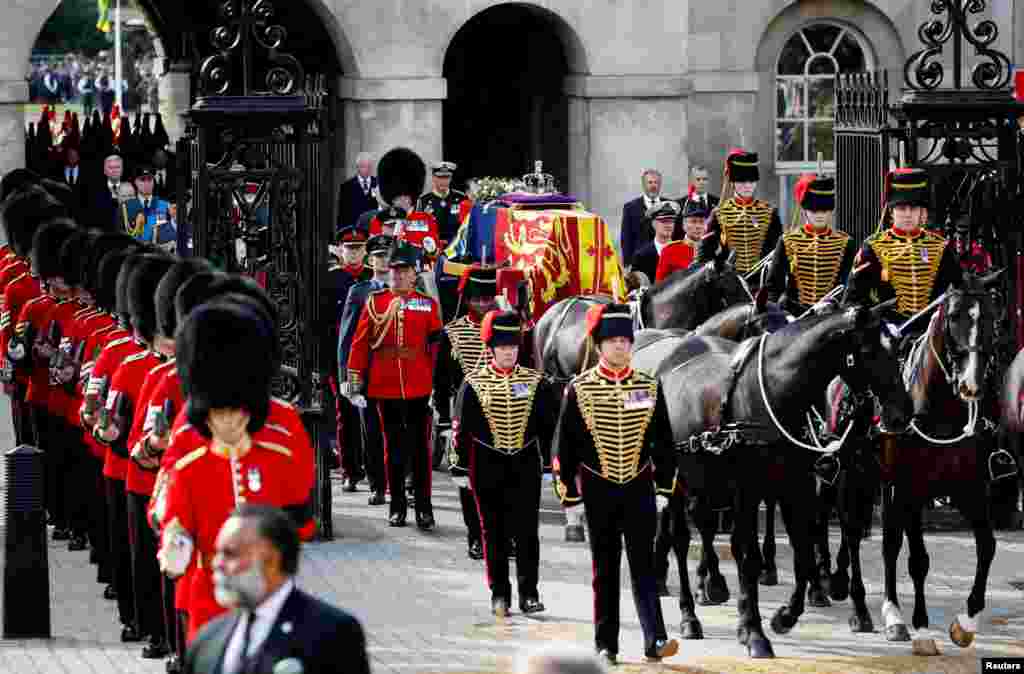 Royal guards march in the procession of the coffin of Britain's Queen Elizabeth II in London, Sept. 14, 2022.
