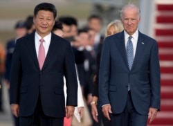 资料照：中国国家主席习近平与时任美国副总统拜登