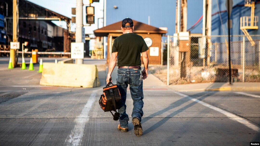 FILE - A steel worker returns to work after a being idle for two years at U.S. Steel Granite City Works in Granite City, Illinois, May 24, 2018.