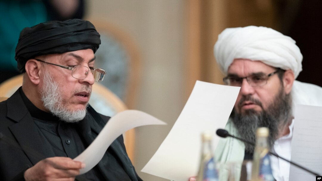 Participants of a conference on Afghanistan read papers in Moscow, Russia, Nov. 9, 2018. 