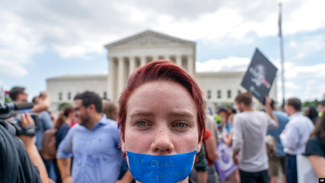 An abortion-rights protester wearing tape that reads "2nd Class Citizen" demonstrates following Supreme Court's decision to overturn Roe v. Wade outside the Supreme Court in Washington.