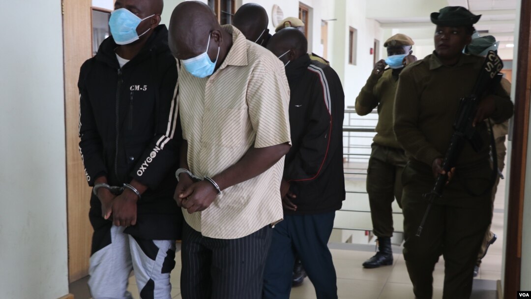 Albino attackers leave court after they are sentenced on June 27 , 2022. (Lameck Masina/VOA)