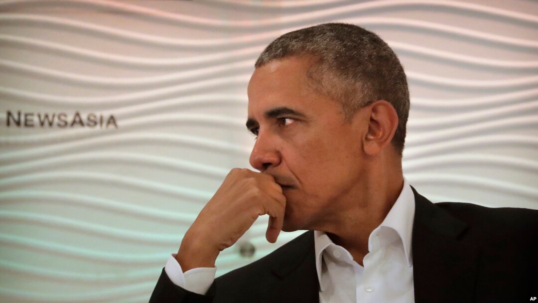 FILE - Former U.S. President Barack Obama listens to a question during a leadership summit in New Delhi, India, Dec. 1, 2017. 