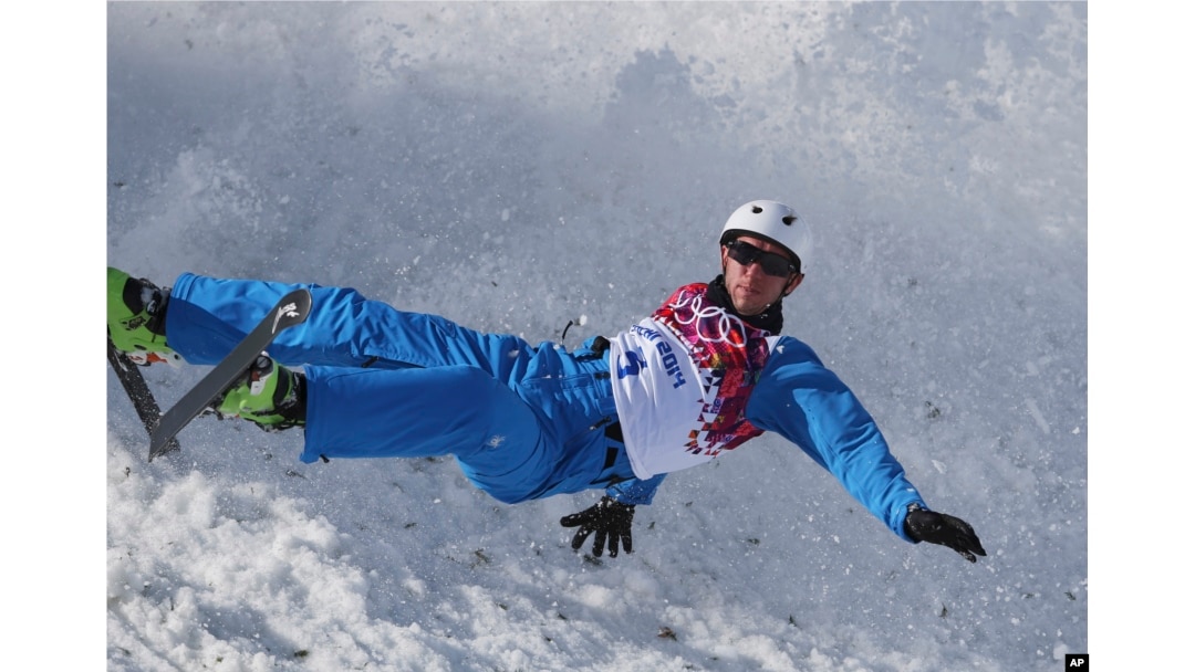 FILE - Anton Kushnir of Belarus crashes during men's freestyle skiing aerials training at the Rosa Khutor Extreme Park, at the 2014 Winter Olympics in Krasnaya Polyana, Russia, Feb. 12, 2014.