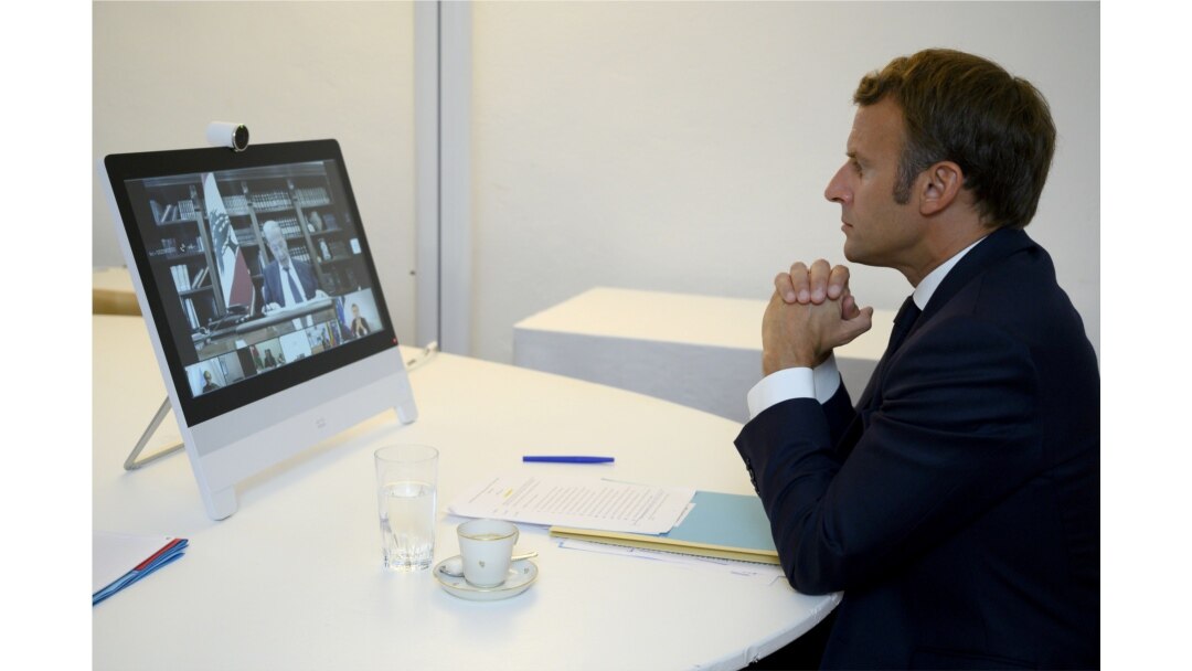 FILE - French President Emmanuel Macron attends a donor teleconference with other world leaders concerning the situation in Lebanon following the Beirut blast, in Fort de Bregancon in Bormes-les-Mimosas, France, Aug. 9, 2020.
