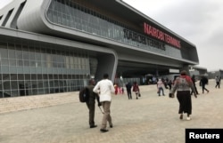 FILE - Passengers arrive to purchase tickets for the Standard Gauge Railway (SGR) line constructed by the China Road and Bridge Corporation (CRBC) and financed by Chinese government at the Nairobi Terminus in the outskirts Nairobi, Kenya, July 28, 2017.