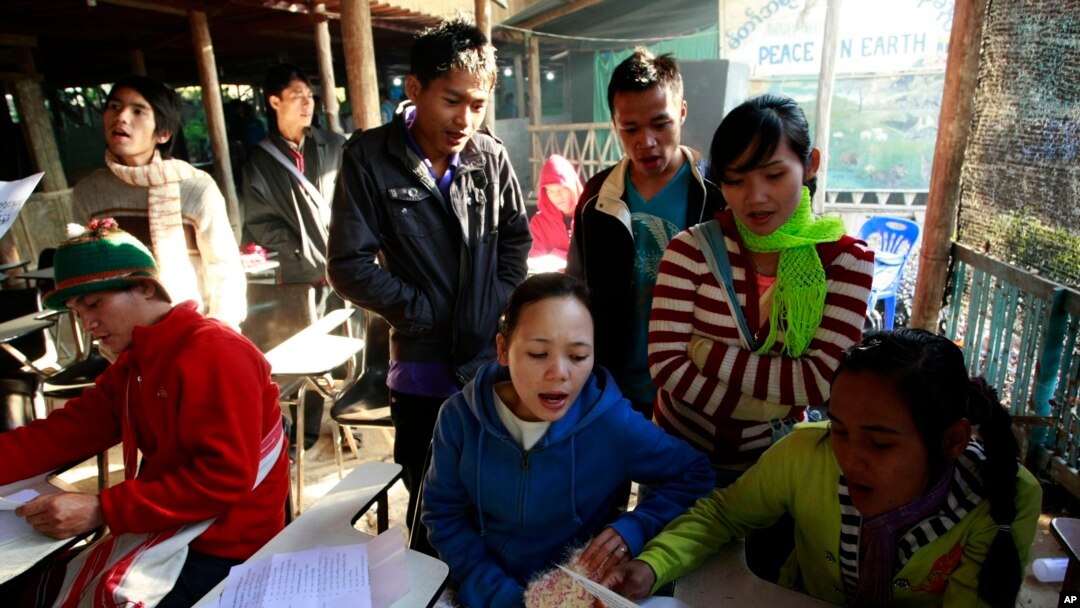 Karen refugees practice their singing before a morning prayers at a church inside Mae La refugee camp in Tha Song Yang district, Tak province northern Thailand, Jan. 19, 2012.