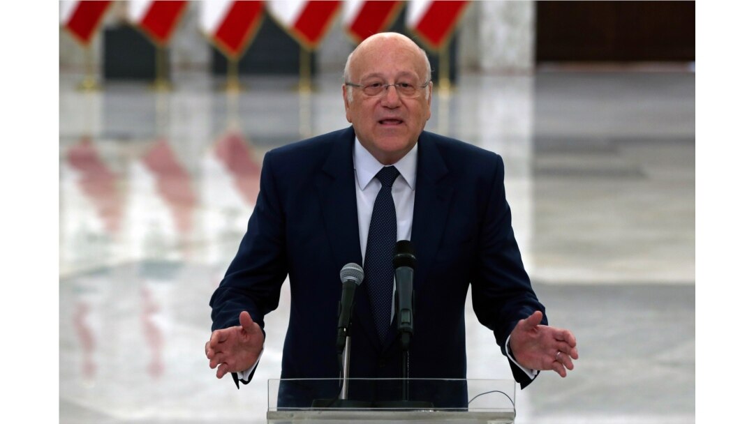 FILE - Lebanese Prime Minister-designate Najib Mikati, speaks to journalists after his meeting with Lebanese President Michel Aoun, at the Presidential Palace in Baabda, east of Beirut, Lebanon, July 26, 2021.