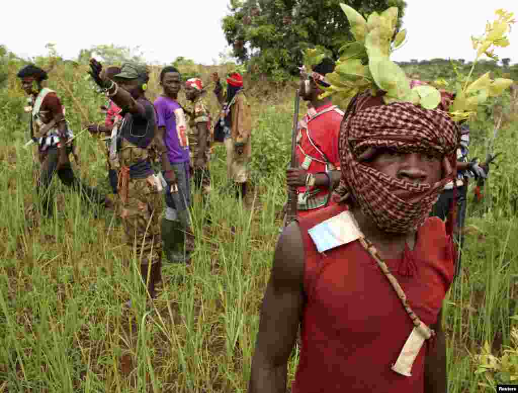 Members of the anti-balaka, a Christian militia, patrol outside the village of Zawa, Central African Republic, April 8, 2014.