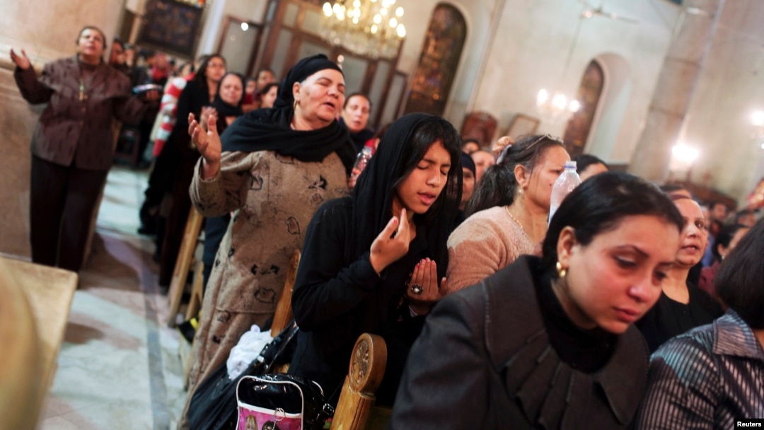 Coptic Christians pray at St Mark Cathedral in Cairo, Dec. 26, 2014.