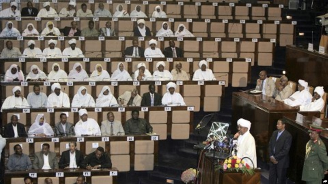 Sudanese President Omar al-Bashir, third right, talks at the National Assembly in Khartoum, Sudan, July 12, 2011
