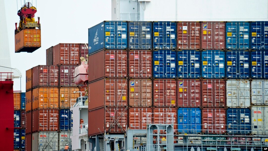 Container is loaded onto a cargo ship at Tianjin port in China. A United Nations report says China's growth is expected to be 6.5 percent this year. However, export-driven Asian economies could face problems if protectionist policies gain popularity.