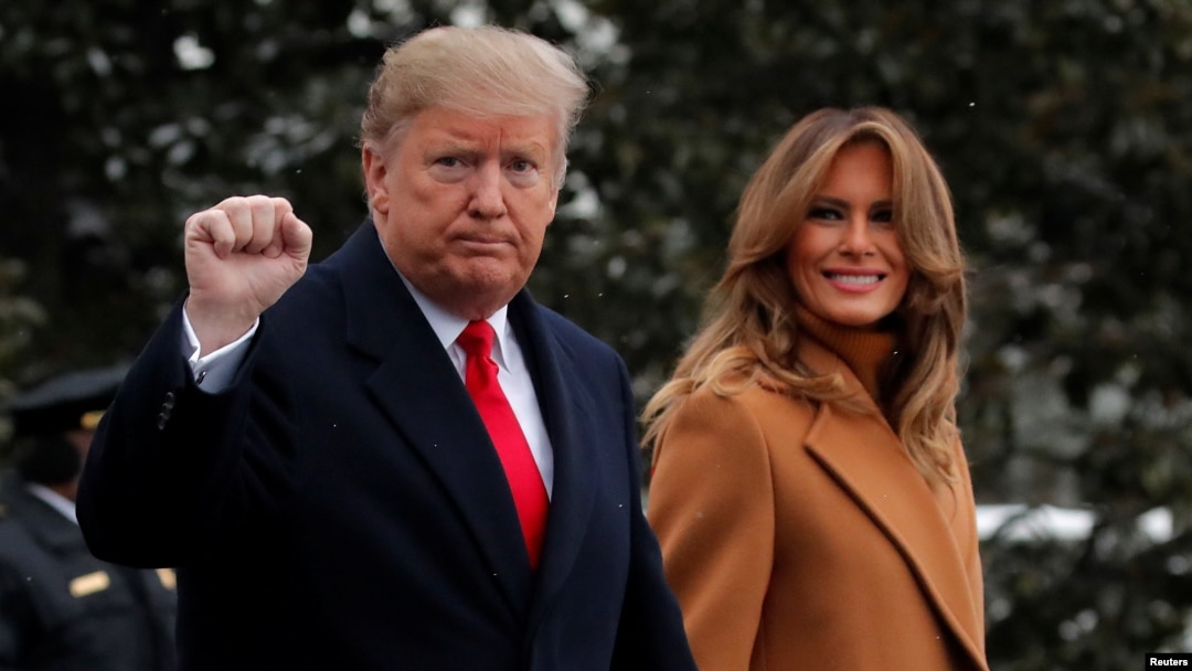 U.S. President Donald Trump walks with first lady Melania Trump while departing for Palm Beach, Fla., from the White House in Washington, Feb. 1, 2019.