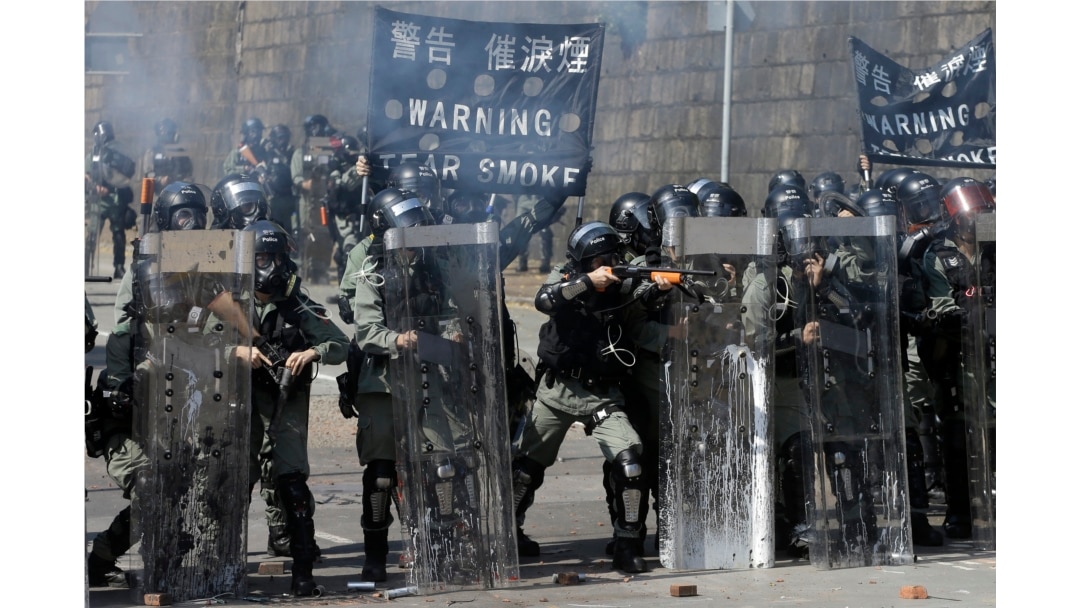 Police prepare to fire on protestors at the Hong Kong Polytechnic University in Hong Kong, Nov. 17, 2019.