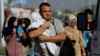 Palestinians flee north Gaza towards the south, amid the ongoing conflict between Israel and Palestinian Islamist group Hamas, in the central Gaza Strip