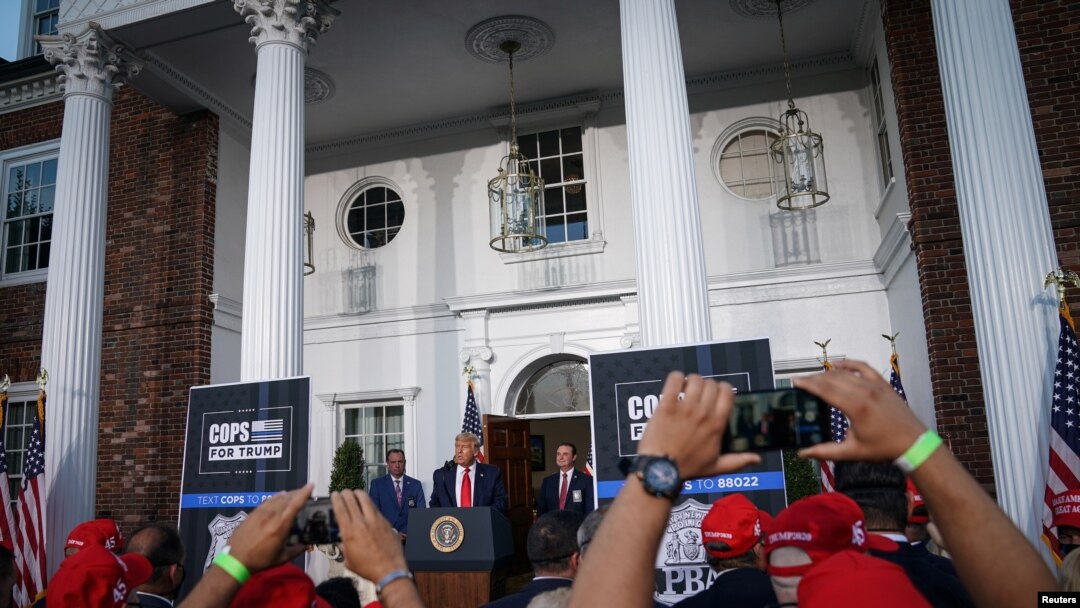 FILE - U.S. President Donald Trump delivers remarks to the City of New York Police Benevolent Association at Trump National Golf Club in Bedminster, New Jersey, Aug. 14, 2020. 