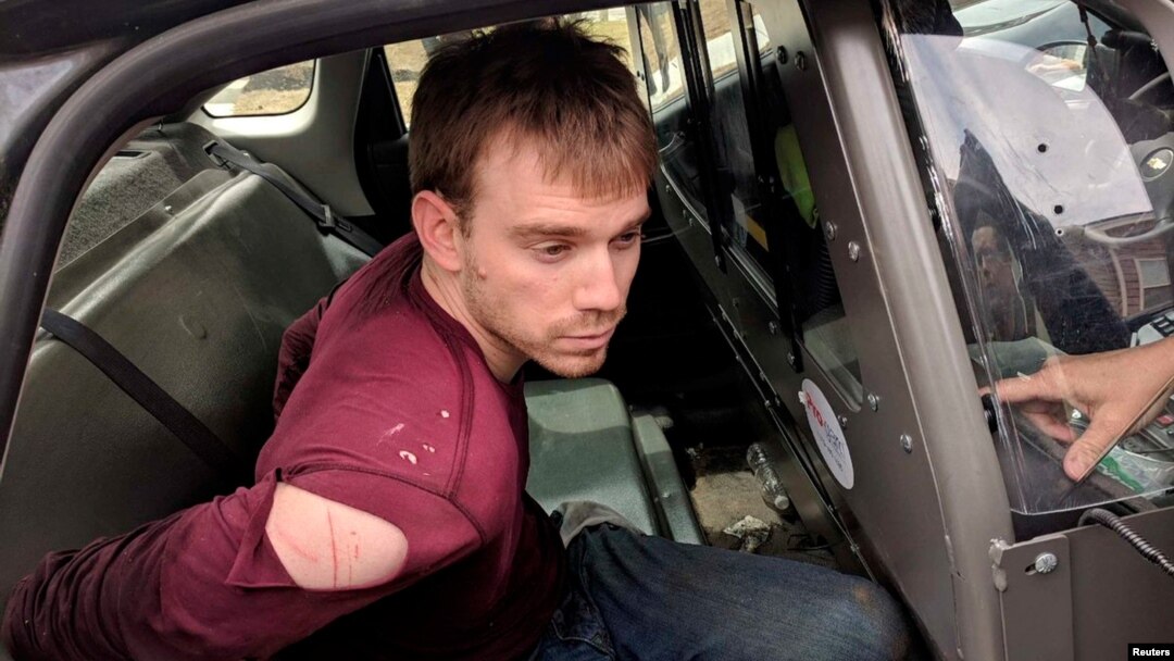 Travis Reinking, the suspect in a Waffle House shooting in Nashville, is under arrest by Metro Nashville Police Department in a wooded area in Antioch, Tennessee, April 23, 2018. 