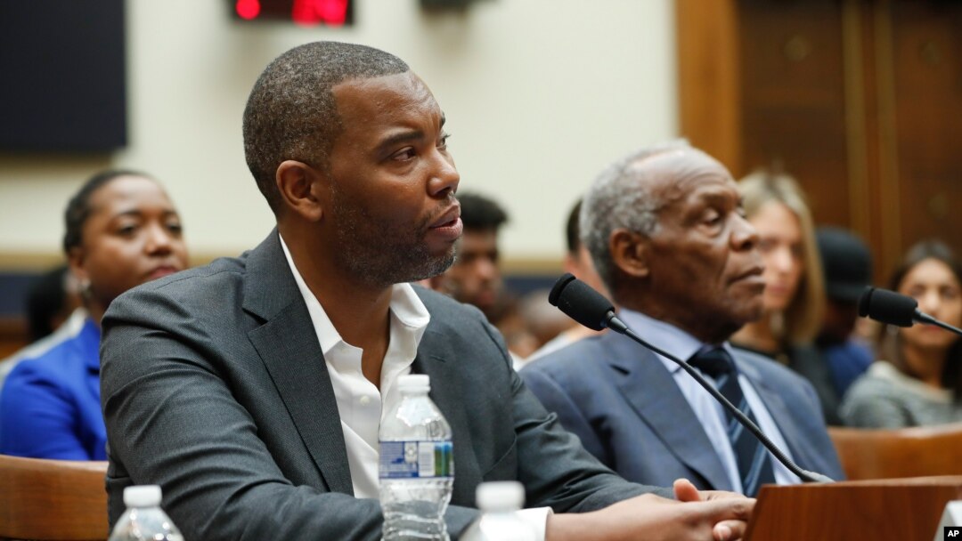 Author Ta-Nehisi Coates, left, and actor Danny Glover, right, testify about reparation for the descendants of slaves during a hearing before the House Judiciary Subcommittee on the Constitution, Civil Rights and Civil Liberties, Washington, June 19, 2019.