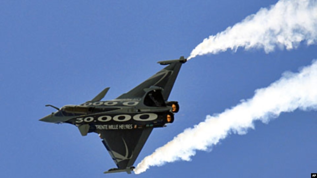 FILE - A Dassault Rafale fighter jet takes part in a flying display at the Le Bourget airport near Paris in this June 2011 file photo