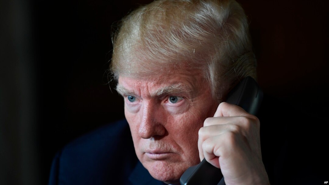 President Donald Trump talks with troops via teleconference from his Mar-a-Lago estate in Palm Beach, Fla., Nov. 22, 2018. 