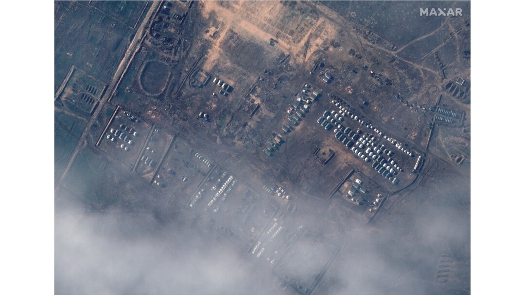This satellite image released by Maxar Technologies on Dec. 23, 2021, reportedly shows Russian ground forces deployed at the Opuk training area on Dec. 22, 2021. (Photo by Handout/Satellite image ©2021 Maxar Technologies / AFP)