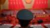 资料照片: 2024年3月5日解放军乐团成员在全国人民代表大会开幕式前站立。