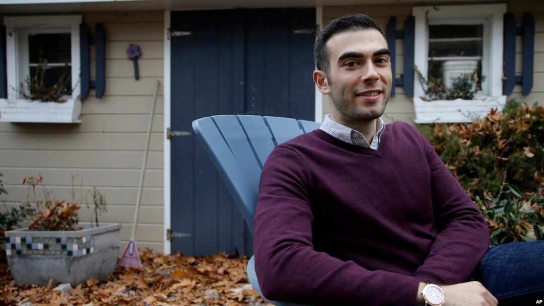 Joshua Pickar, of Lexington, Mass., one of 32 new Rhodes scholars from the U.S., sits for a photograph, Nov. 20, 2016, in Lexington. 