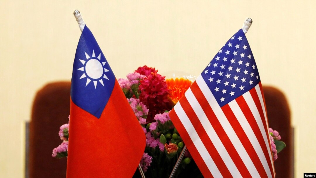 FILE - Flags of Taiwan and US in place for a meeting between US and Taiwan legislators in Taipei, Taiwan March 27, 2018.