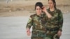Young female fighters say they they hope to battle Islamic State militants after mass rapes, executions and kidnappings that the United Nations says amounts to genocide, Nov. 14, 2016, in Snuny, Iraq. (H. Murdock/VOA)