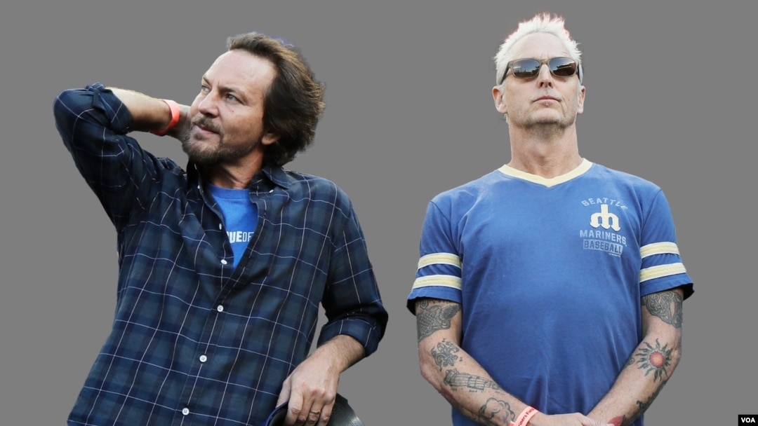 Eddie Vedder (L) lead singer of the rock band Pearl Jam, and guitarist Mike McCready.