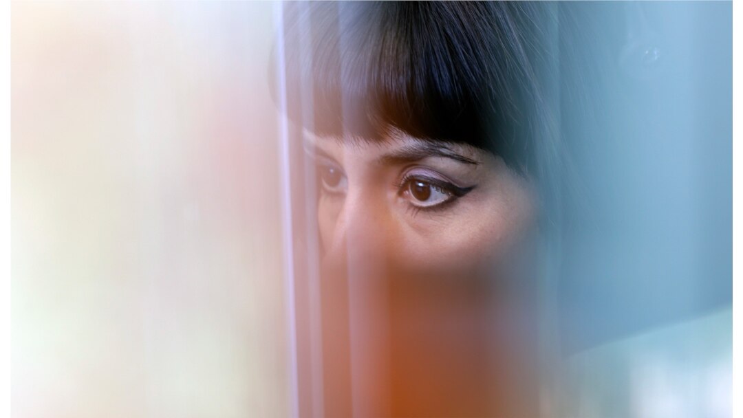 FILE - An advocate works in a cubicle at the National Domestic Violence Hotline center's facility in Austin, Texas, June 27, 2016.