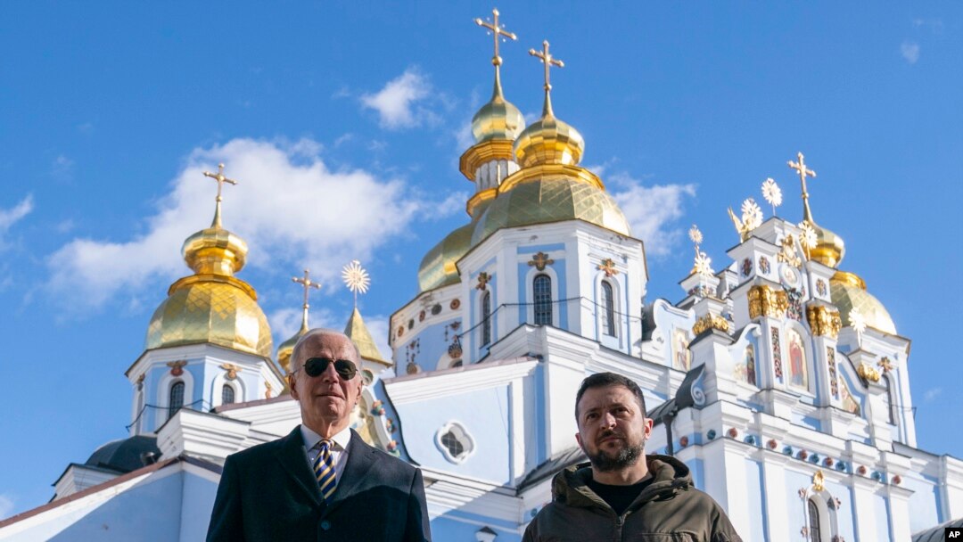 U.S. President Joe Biden walks with Ukrainian President Volodymyr Zelenskyy at St. Michael's Golden-Domed Cathedral on a surprise visit, Monday, Feb. 20, 2023, in Kyiv. (AP Photo/ Evan Vucci)