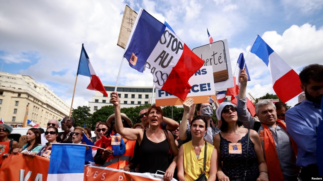 Protesters attend a demonstration called by the French nationalist party "Les Patriotes" against restrictions, including a compulsory health pass, to fight COVID-19, outside the Ministry of Health in Paris, France, July 31, 2021.