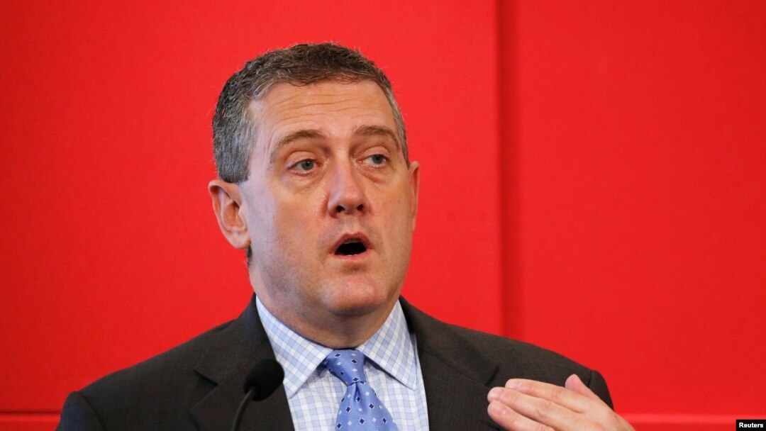 FILE - St. Louis Federal Reserve President James Bullard speaks at a public lecture in Singapore, May 26, 2016. 