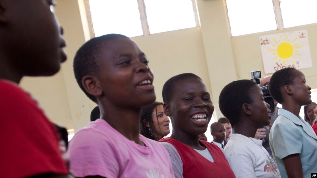 FILE - An aisle of girls at Camp GLOW (Girls Leading Our World) run by the Peace Corps, in Lilongwe, Malawi.