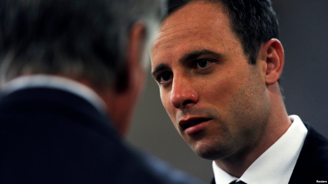 FILE - South African Olympic and Paralympic sprinter Oscar Pistorius arrives in court for closing arguments of his trial at the North Gauteng High Court in Pretoria, Aug. 7, 2014. 