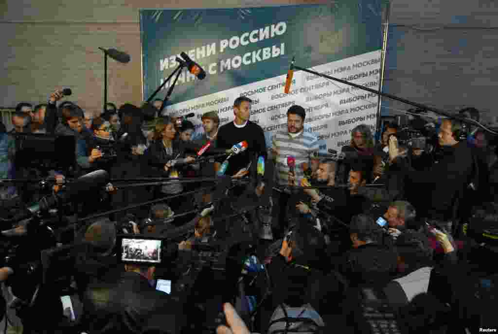 Opposition leader Alexei Navalny speaks to the media at his campaign headquarters after voting closed in the mayoral election in Moscow, Sept. 8, 2013.