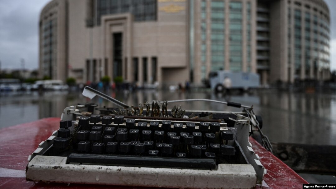 FILE - A broken typewriter is symbolically displayed outside Istanbul's courthouse during the trial of a journalist on charges of supporting Kurdish militants, Sept. 30, 2021. At least six Kurdish journalists have been detained in Turkey so far in January 2025.