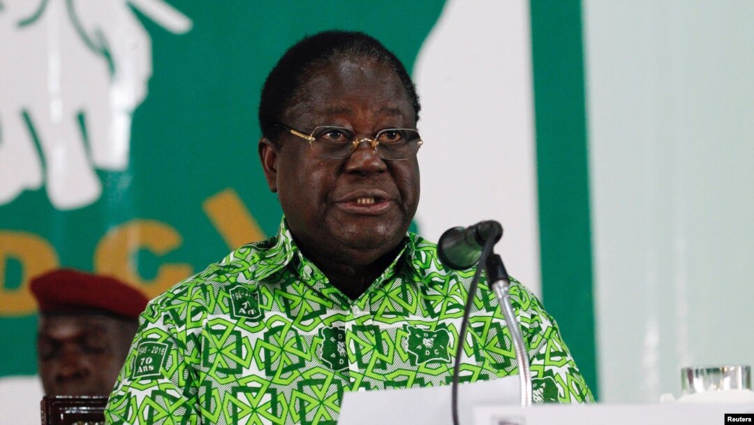 FILE - Former President Henri Konan Bedie speaks during his party's Parti Democratique de la Cote d'Ivoire (PDCI) meeting in Daoukro, Ivory Coast, Oct. 15, 2018.