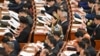人大代表在北京出席中国第十四届全国人民代表大会三次会议第二次全体会议。(2025年3月8日)