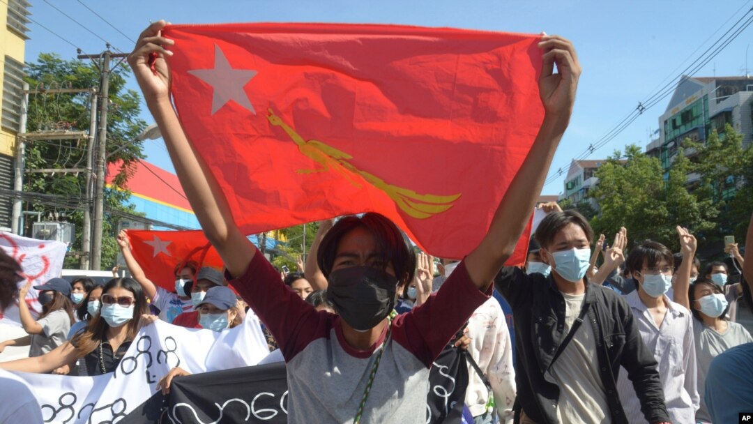 Protesters against Myanmar's junta burn the flag of the Association of Southeast Asian Nations (ASEAN), in Mandalay, Myanmar, June 5, 2021.