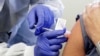 AP-NORC Poll: Half of Americans Would Get a COVID-19 Vaccine