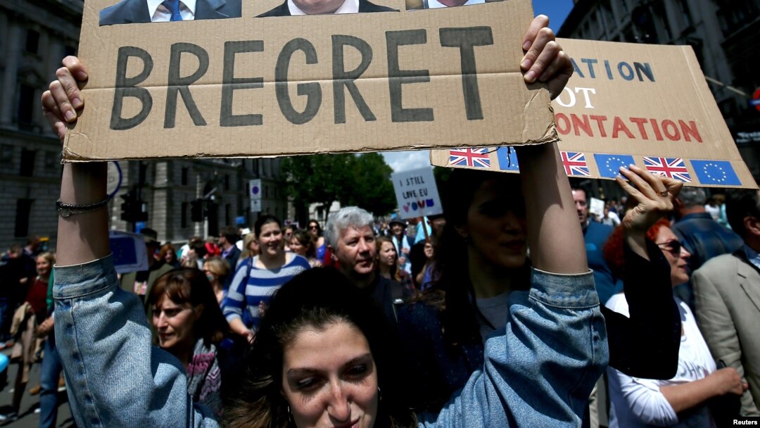 FILE - People hold banners during a 'March for Europe' demonstration against Britain's decision to leave the European Union, in central London, Britain, July 2, 2016. (REUTERS/Neil Hall)