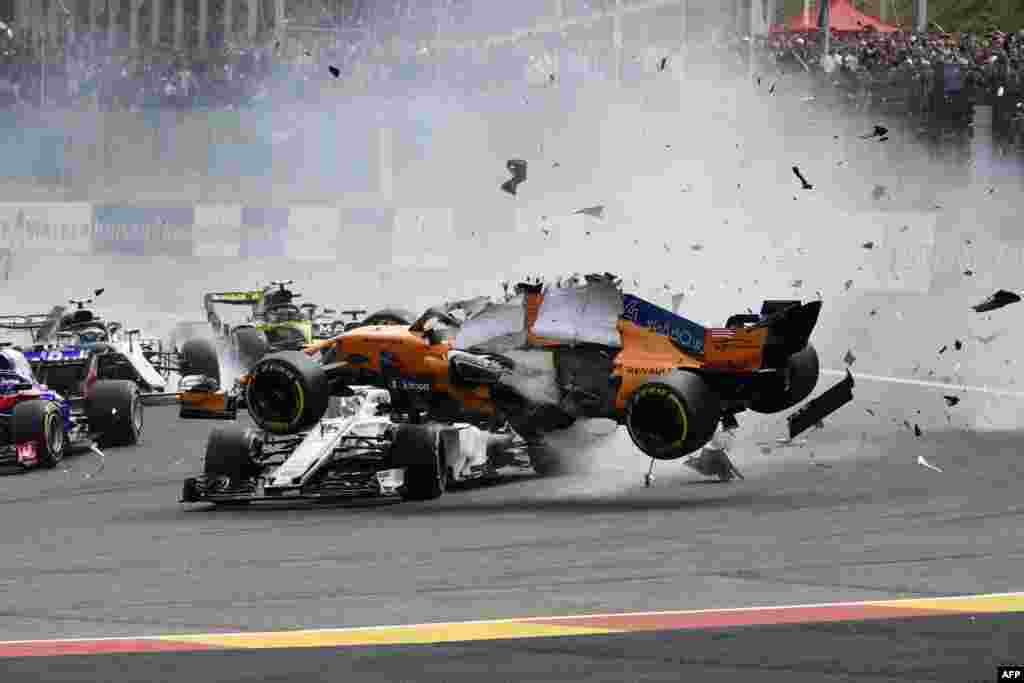 McLaren's Spanish driver Fernando Alonso crashes during the Belgian Formula One Grand Prix at the Spa-Francorchamps circuit in Spa, Belgium.