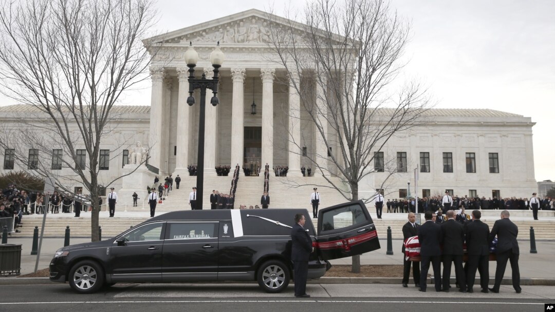The body of Justice Antonin Scalia arrives at the Supreme Court in Washington, Feb. 19, 2016. Thousands of mourners will pay their respects to him Friday in the court building's Great Hall.