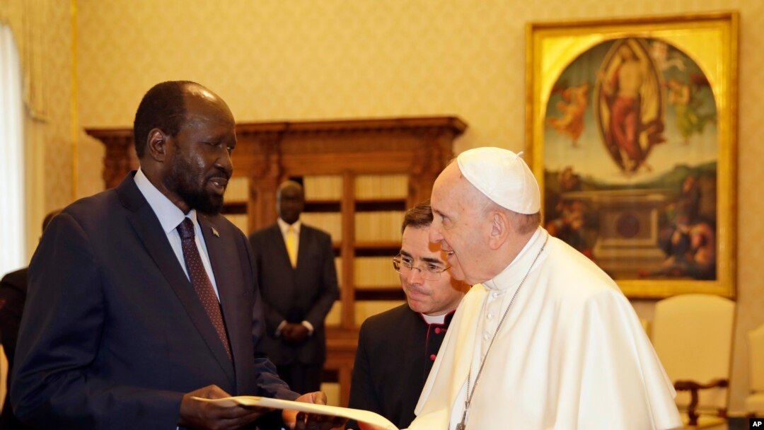 FILE - Pope Francis exchanges gifts with South Sudan President Salva Kiir during a private audience at the Vatican, March 16, 2019.