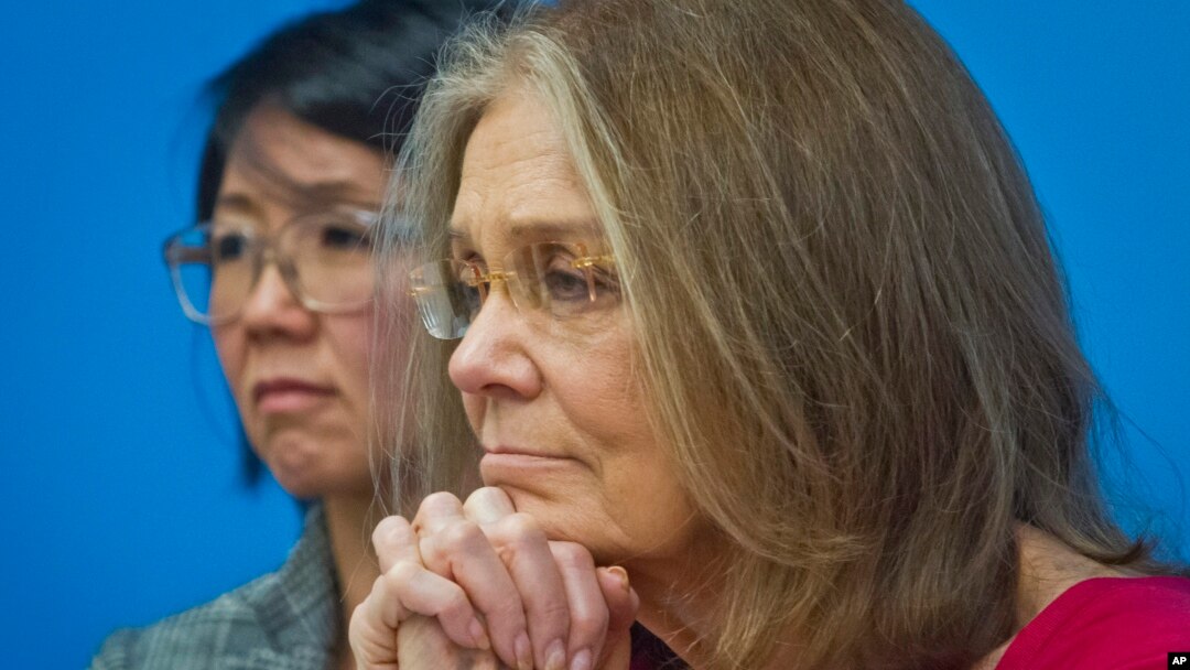 FILE - Gloria Steinem, right, and Christine Ahn of of WomenCrossDMZ listen during a U.N. news conference announcing plans for a women's walk across the demilitarized zone between North and South Korea to call for reunification, March 11, 2015. 