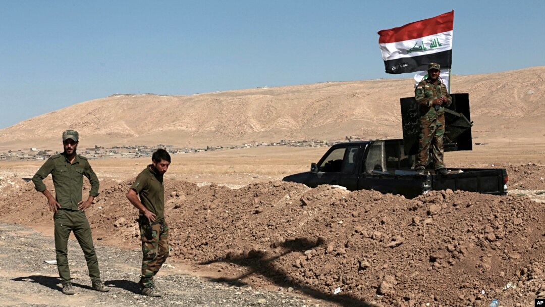 Shiite Popular Mobilization Forces take control of a former Kurdish security forces checkpoint outside Bashiqa, Iraq, Oct. 18, 2017. 
