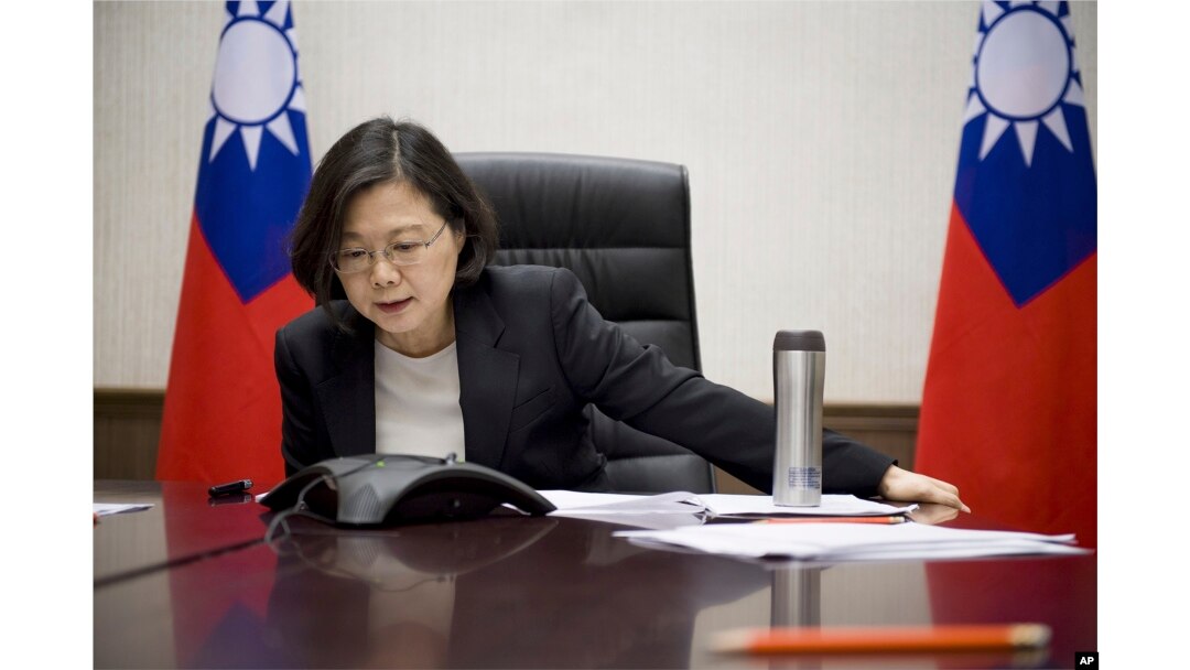 Taiwan's President Tsai Ing-wen speaks with U.S. President-elect Donald Trump through a speaker phone in Taipei, Taiwan. (Taiwan Presidential Office via AP)